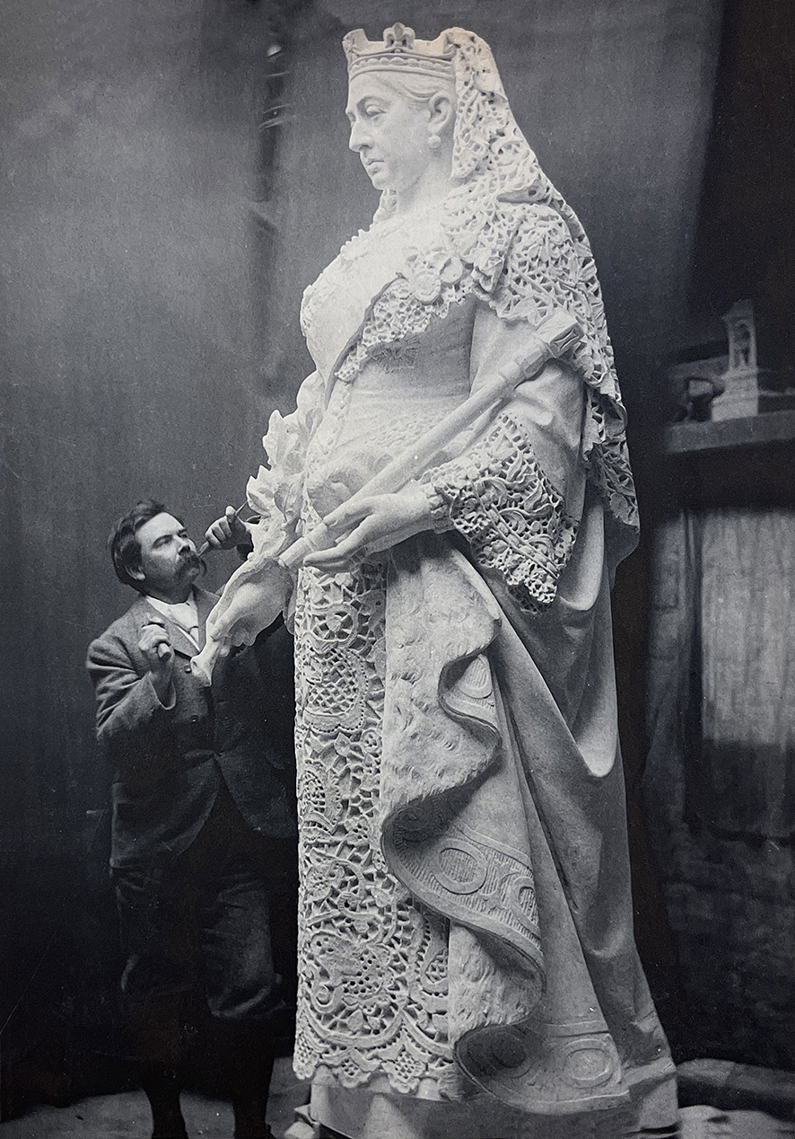 John Cassidy working on statue of Queen Victoria, 1897